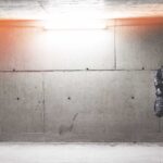 Young Man Standing In Front of Concrete Wall