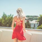 Young Blonde Woman Looking Around on Terrace