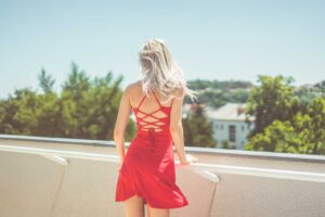 Young Blonde Woman Looking Around on Terrace