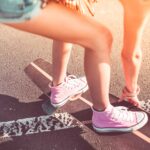 Young Girl with Pink Shoes on Longboard