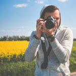 Young Photographer in Action Taking a Photo