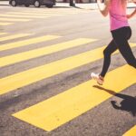 Blonde Woman Running Over The Pedestrian Crossing